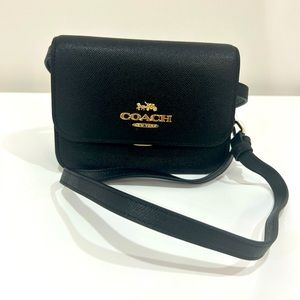 NEVER USED black Coach crossbody with gold hardware. Perfect condition.